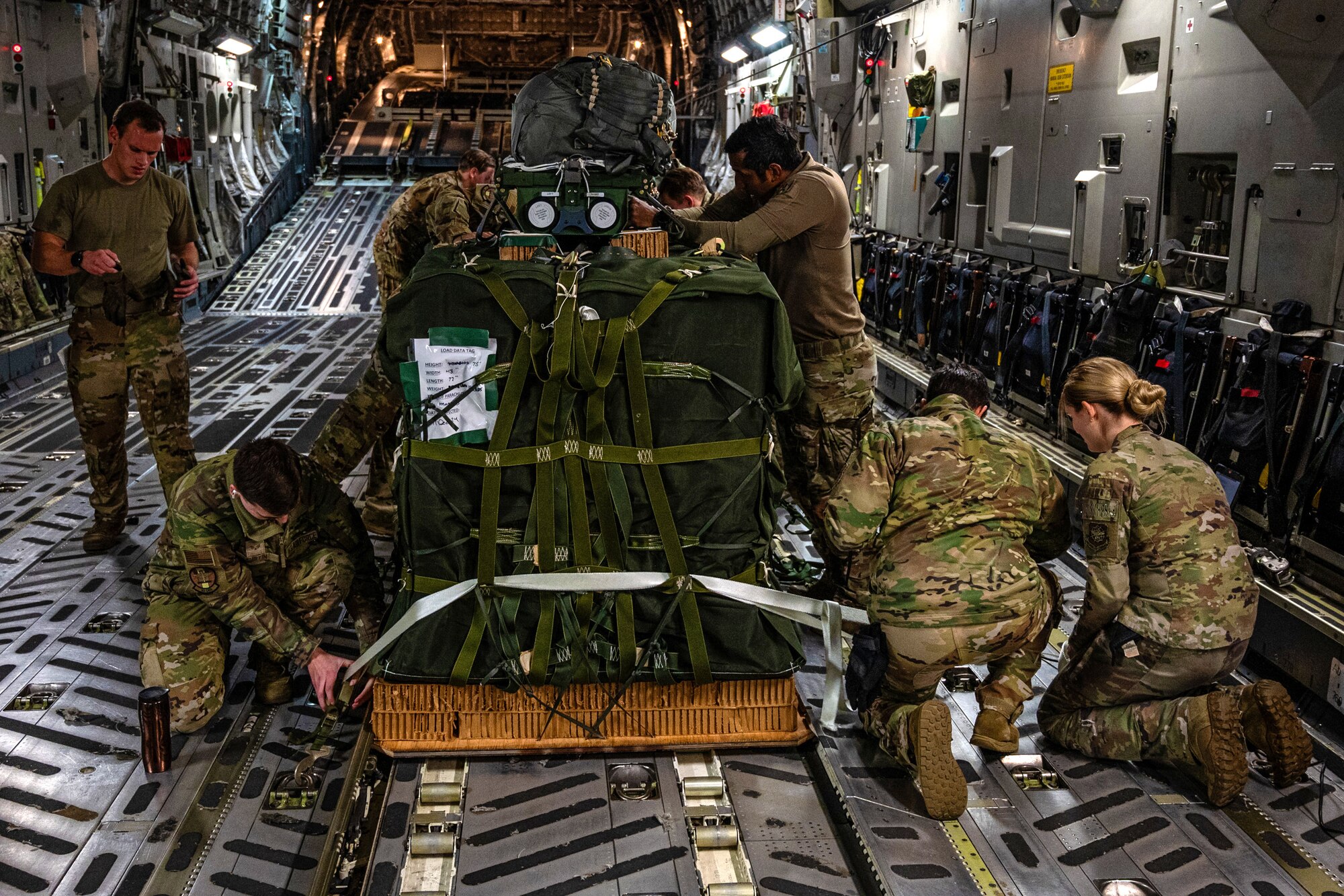 U.S. Air Force Airmen from the 8th Airlift Squadron and Army Soldiers from the 2nd Ranger Battalion conducted Joint Precision Airdrop System training near Yakima, Washington, Dec. 12, 2024.