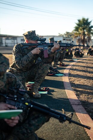 U.S. Marine Corps Recruit Magnus Ricketts, sights in with his rifle during a grass week training event at Marine Corps Base Camp Pendleton, California, Dec 18, 2024. Recruits use the Mantis technology which provides feedback on how much an individual moved during the trigger pull and will provide feedback on how to improve shooting mechanics. The Marine Corps implemented the Mantis system to further assist recruits in developing their warfighting skills. (U.S. Marine Corps photo by Cpl. Francisco Angel)