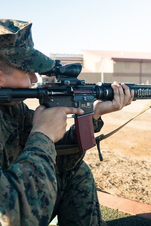 U.S. Marine Corps Recruit Magnus Ricketts, sights in with his rifle during a grass week training event at Marine Corps Base Camp Pendleton, California, Dec 18, 2024. Recruits use the Mantis technology which provides feedback on how much an individual moved during the trigger pull and will provide feedback on how to improve shooting mechanics. The Marine Corps implemented the Mantis system to further assist recruits in developing their warfighting skills. (U.S. Marine Corps photo by Cpl. Francisco Angel)