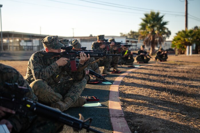 U.S. Marine Corps Recruit Magnus Ricketts, sights in with his rifle during a grass week training event at Marine Corps Base Camp Pendleton, California, Dec 18, 2024. Recruits use the Mantis technology which provides feedback on how much an individual moved during the trigger pull and will provide feedback on how to improve shooting mechanics. The Marine Corps implemented the Mantis system to further assist recruits in developing their warfighting skills. (U.S. Marine Corps photo by Cpl. Francisco Angel)