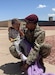 Sgt. 1st Class Kaishaun Waller holding his son photo