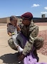 Sgt. 1st Class Kaishaun Waller holding his son photo