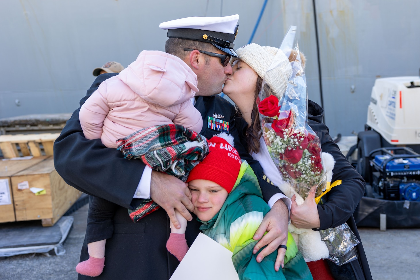 Chief Gunner’s Mate Tyler Kaltenberg, assigned to the Arleigh Burke-class guided-missile destroyer USS Cole (DDG 67), greets family on the pier after returning from deployment. Cole returned to Naval Station Norfolk after a deployment in support of maritime security and stability efforts in the U.S. 5th and 6th Fleet areas of operation.