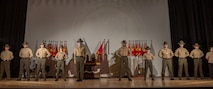 U.S. Marines Corps instructors with Marine Corps Recruit Depot San Diego Drill Instructor School, are introduced during the DI school 1-25 graduation ceremony at MCRD San Diego, California, Dec. 18, 2024. During DI school, Marines developed leadership skills, mastered drill, met physical fitness requirements and learned how to make Marines. Our Marines continue to serve their nation and their Corps through their lived examples of our values and by helping to identify and select potential recruits who may have what it takes to earn the title. (U.S. Marine Corps photo by Lance Cpl. Janell B. Alvarez)