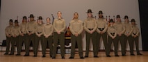 U.S. Marines with Marine Corps Recruit Depot San Diego Drill Instructor School, pose for a photo during the DI school 1-25 graduation ceremony at Marine Corps Recruit Depot San Diego, California, Dec. 18, 2024. During DI school, Marines developed leadership skills, mastered drill, met physical fitness requirements and learned how to make Marines. Our Marines continue to serve their nation and their Corps through their lived examples of our values and by helping to identify and select potential recruits who may have what it takes to earn the title. (U.S. Marine Corps photo by Lance Cpl. Janell B. Alvarez)