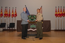 Retired U.S. Marine Corps Maj. Brian A. Kiraly, the guest of honor, left, and the senior enlisted Marine of Marine Corps Recruit Depot San Diego Drill Instructor School, 1st Sgt. Omar Garcia with MCRDSD DI School, pose for a photo during the DI school 1-25 graduation ceremony at MCRD San Diego, California, Dec. 18, 2024. During DI school, Marines developed leadership skills, mastered drill, met physical fitness requirements and learned how to make Marines. Our Marines continue to serve their nation and their Corps through their lived examples of our values and by helping to identify and select potential recruits who may have what it takes to earn the title. (U.S. Marine Corps photo by Lance Cpl. Janell B. Alvarez)