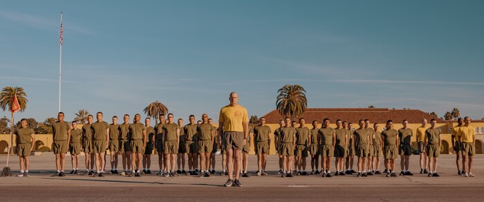 U.S. Marine Corps Senior Drill Instructor, Staff Sgt. Riley Cotton, with Fox Company, 2nd Recruit Training Battalion, conducts dynamic warm-ups prior to the company motivational run at Marine Corps Recruit Depot San Diego, California, Dec. 19, 2024. The company motivational run is a three-mile cadence run conducted around the Depot and is the last physical training event the Marines will conduct before they graduate from MCRD San Diego. The event is also the first time friends and families will see their newly transformed Marines. The same fighting spirit that led Marines in the fight at Chapultepec, Belleau Wood, Iwo Jima, Okinawa, the Chosin Reservoir, Vietnam, in Fallujah and Marjah thrives in our Marines today. (U.S. Marine Corps photo by Lance Cpl. Janell B. Alvarez)