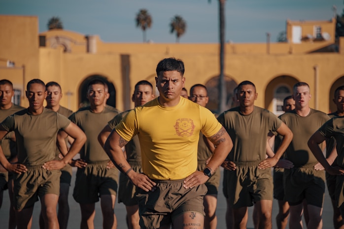 U.S. Marine Corps Senior Drill Instructor, Staff Sgt. Osvaldo Diaz, with Fox Company, 2nd Recruit Training Battalion, conducts dynamic warm-ups prior to the company motivational run at Marine Corps Recruit Depot San Diego, California, Dec. 19, 2024. The company motivational run is a three-mile cadence run conducted around the Depot and is the last physical training event the Marines will conduct before they graduate from MCRD San Diego. The event is also the first time friends and families will see their newly transformed Marines. The same fighting spirit that led Marines in the fight at Chapultepec, Belleau Wood, Iwo Jima, Okinawa, the Chosin Reservoir, Vietnam, in Fallujah and Marjah thrives in our Marines today. (U.S. Marine Corps photo by Lance Cpl. Janell B. Alvarez)