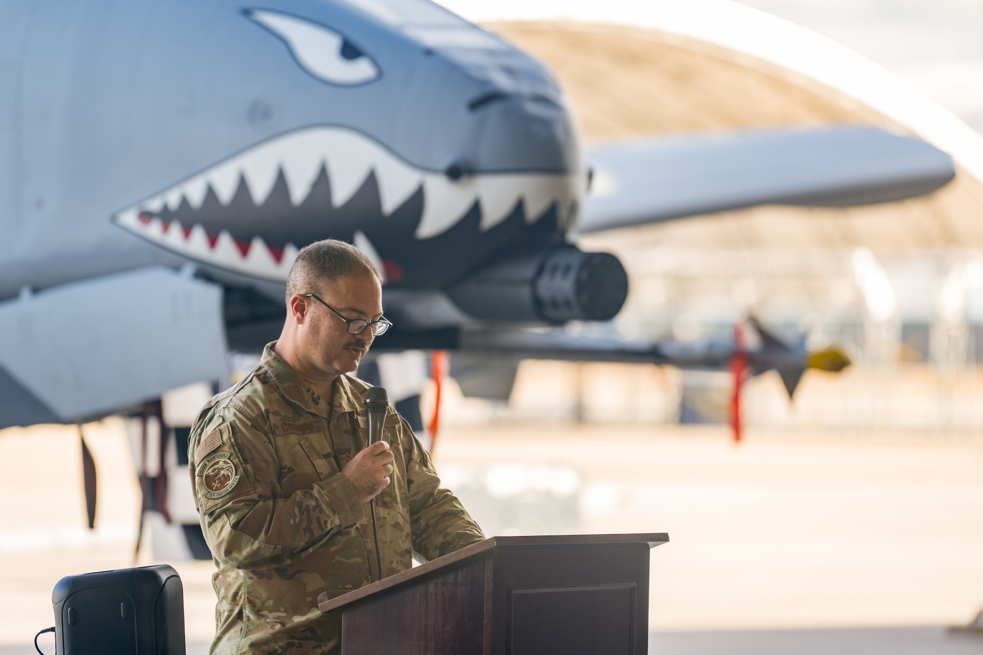 U.S. Air Force Master Sgt. James Caruana, 75th Fighter Generation Squadron production superintendent, speaks at the Dedicated Crew Chief (DCC) Ceremony at Moody Air Force Base, Georgia, Dec. 16, 2024. The DCC Ceremony recognizes the best crew chiefs in the squadron, earning the title of dedicated crew chief with each receiving ownership over a specific A-10C Thunderbolt II aircraft. (U.S. Air Force photo by Airman 1st Class Iain Stanley)