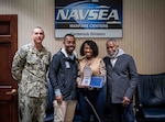 Carderock Commanding Officer, Capt. Chris Matassa, presents Lisa A. Harden with the Department of the Navy Meritorious Civilian Service Award alongside her son and husband at Naval Surface Warfare Center Carderock Division on Dec. 4, 2024. Carderock, the Navy's innovation and ship design powerhouse, headquartered in West Bethesda, Maryland, is a world-class research and development facility specializing in critical ship design components. Carderock uses state-of-the-art facilities, like the David Taylor Model Basin, to create small-scale models and evaluate next-generation surface ships and underwater vessels, ensuring they are future-proof, agile, and equipped to dominate the maritime environment.