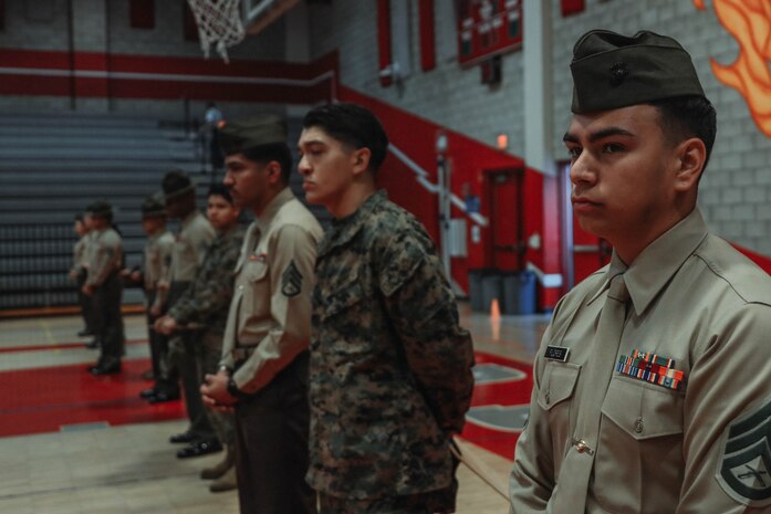 U.S. Marine Corps Staff Sgt. Angel Flores, station commander with Recruiting Sub-Station National City, Recruiting Station San Diego, attends a Junior Reserve Officer Training Corps drill competition at Sweetwater High School in National City, California, Dec. 7, 2024. The Junior Reserve Officer Training Corps drill competition is a formal event where cadets perform synchronized marching routines and precision drill to demonstrate discipline, teamwork and leadership skills. (U.S. Marine Corps photo by Cpl. Alejandro Fernandez)