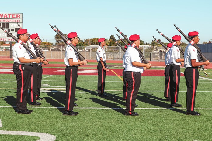 Junior Reserve Officer Training Corps cadets participate in a Junior Reserve Officer Training Corps drill competition at Sweetwater High School in National City, California, Dec. 7, 2024. The Junior Reserve Officer Training Corps drill competition is a formal event where cadets perform synchronized marching routines and precision drill to demonstrate discipline, teamwork and leadership skills. (U.S. Marine Corps photo by Cpl. Alejandro Fernandez)