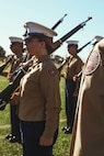 U.S. Marine Corps Sgt. Alanah SunigaJimenez, a canvassing recruiter with Recruiting Sub-Station National City, Recruiting Station San Diego, evaluates cadets during a Junior Reserve Officer Training Corps drill competition at Sweetwater High School in National City, California, Dec. 7, 2024. The Junior Reserve Officer Training Corps drill competition is a formal event where cadets perform synchronized marching routines and precision drill to demonstrate discipline, teamwork and leadership skills. (U.S. Marine Corps photo by Cpl. Alejandro Fernandez)