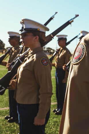 U.S. Marine Corps Sgt. Alanah SunigaJimenez, a canvassing recruiter with Recruiting Sub-Station National City, Recruiting Station San Diego, evaluates cadets during a Junior Reserve Officer Training Corps drill competition at Sweetwater High School in National City, California, Dec. 7, 2024. The Junior Reserve Officer Training Corps drill competition is a formal event where cadets perform synchronized marching routines and precision drill to demonstrate discipline, teamwork and leadership skills. (U.S. Marine Corps photo by Cpl. Alejandro Fernandez)
