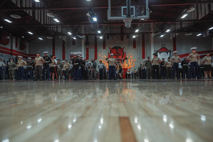 U.S. Marines with Recruiting Station San Diego and Marine Corps Recruit Depot San Diego participate in a Junior Reserve Officer Training Corps drill competition at Sweetwater High School in National City, California, Dec. 7, 2024. The Junior Reserve Officer Training Corps drill competition is a formal event where cadets perform synchronized marching routines and precision drill to demonstrate discipline, teamwork and leadership skills. (U.S. Marine Corps photo by Cpl. Alejandro Fernandez)