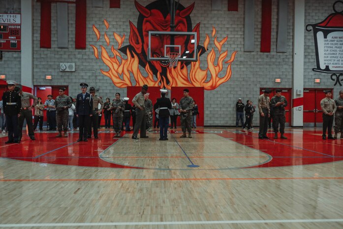 U.S. Marines with Recruiting Station San Diego and Marine Corps Recruit Depot San Diego participate in a Junior Reserve Officer Training Corps drill competition at Sweetwater High School in National City, California, Dec. 7, 2024. The Junior Reserve Officer Training Corps drill competition is a formal event where cadets perform synchronized marching routines and precision drill to demonstrate discipline, teamwork and leadership skills. (U.S. Marine Corps photo by Cpl. Alejandro Fernandez)