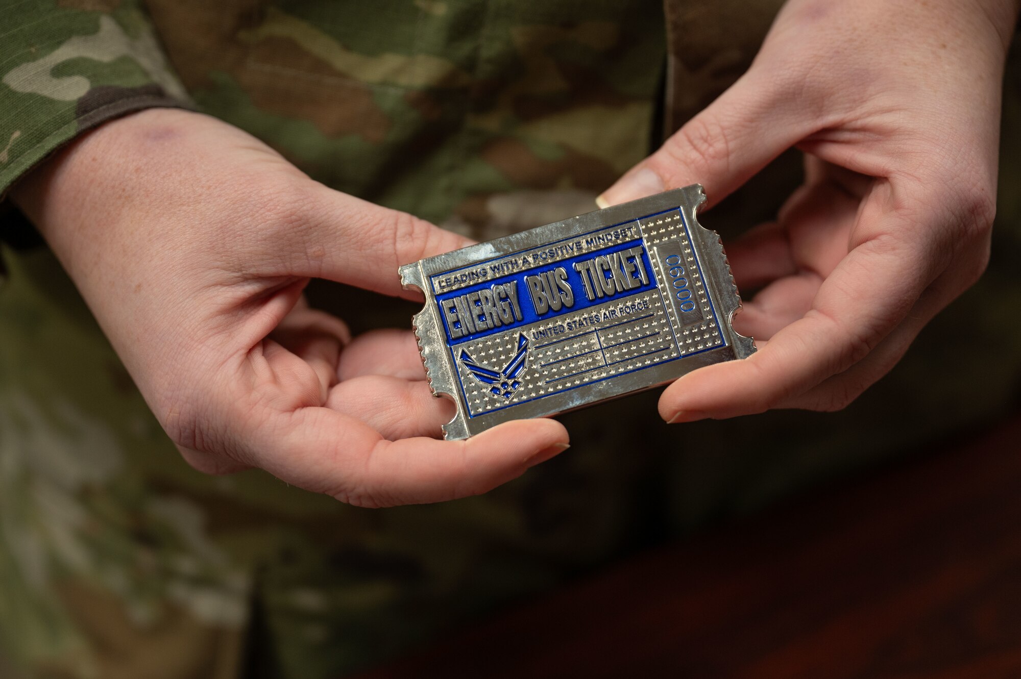 U.S. Air Force Senior Master Sgt Destini Yaden, 9th Bomber Generation Squadron first sergeant, displays her first sergeant coin at Dyess Air Force Base, Texas, Dec. 11, 2024. First sergeants are responsible for the welfare, morale, discipline and readiness of enlisted personnel. (U.S. Air Force photo by Airman 1st Class Emma Anderson)