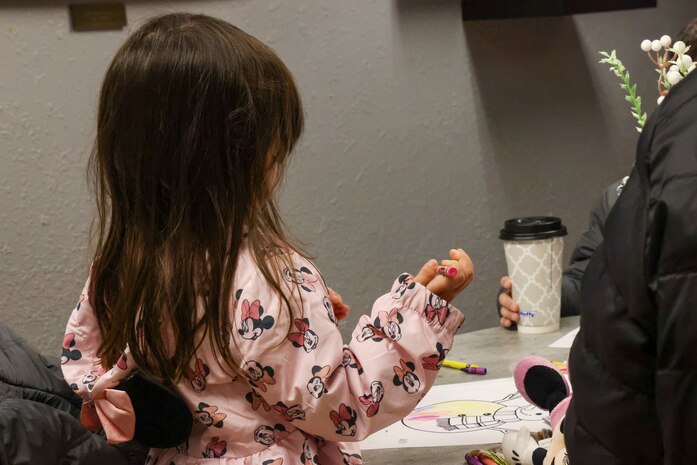 A Beale Air Force Base (AFB) dependent draws while she waits to track and talk to Santa during the 7th Space Warning Squadron's (7 SWS) Santa Tracker event at Beale AFB, California, Dec. 24, 2024.