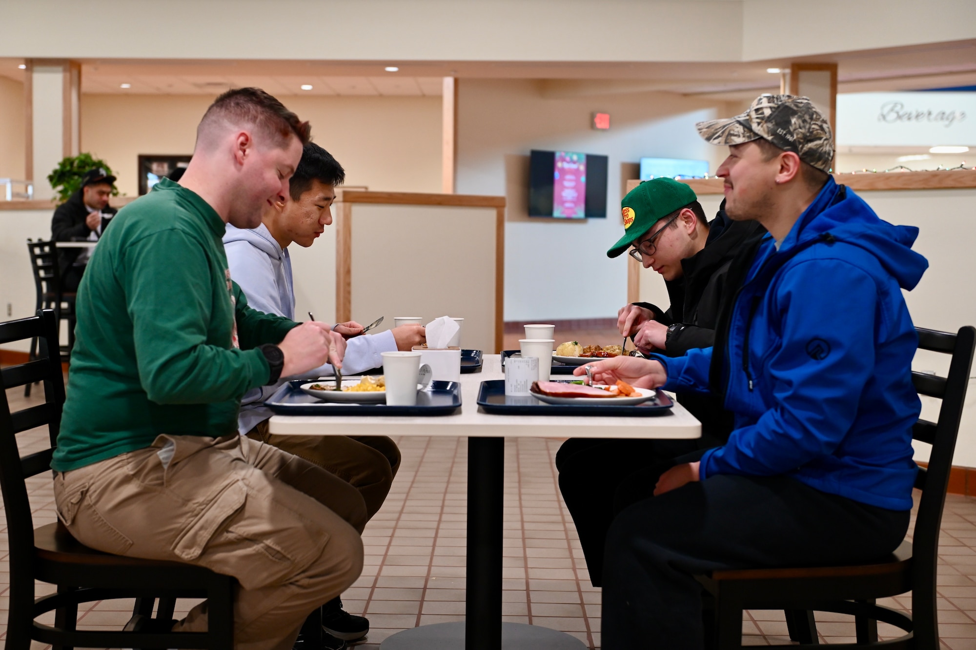 Military members assigned to the 8th Fighter Wing enjoy a holiday meal during the new O’Malley Dining Facility’s opening.