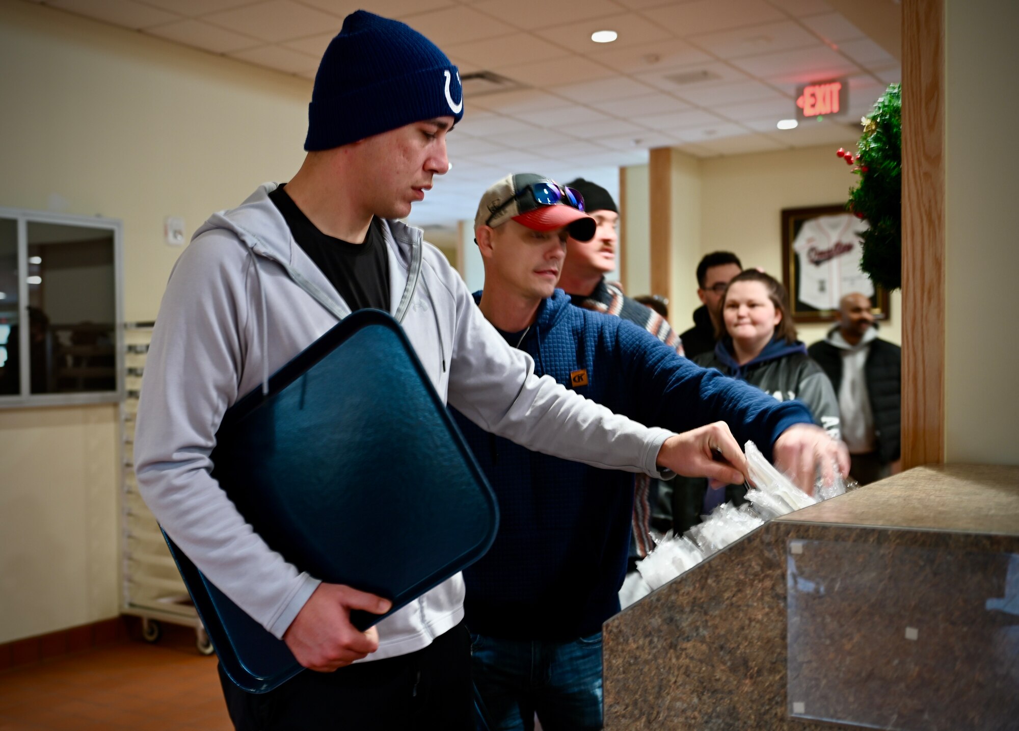 Military members assigned to the 8th Fighter Wing line up to enjoy a holiday meal at the new O’Malley Dining Facility opening.
