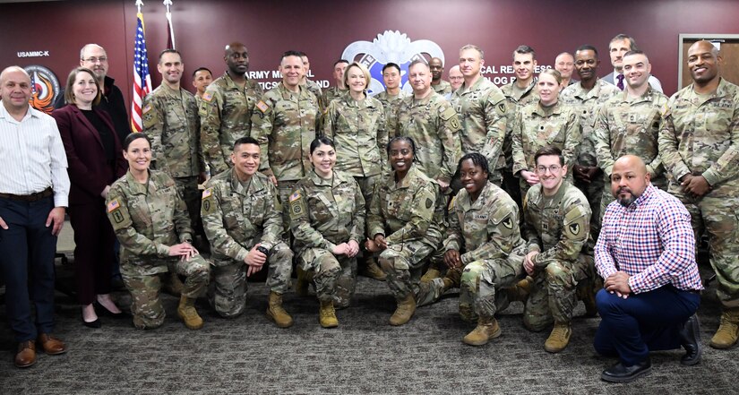 U.S. Army Surgeon General Lt. Gen. Mary K. Izaguirre poses with U.S. Army Medical Logistics Command Commander Col. Marc R. Welde and AMLC leaders Dec. 16 at Fort Detrick, Maryland. (Photo Credit: Ellen Crown)