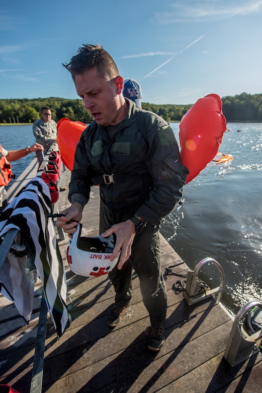 Master Sgt. Darren Wiles, a loadmaster for the Kentucky Air National Guard’s 123rd Contingency Response Group, removes his personal protective equipment after being pulled across the water at Camp Crooked Creek in Shepherdsville, Ky., Sept. 14, 2019, by a personal watercraft as part of routine survival training.