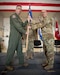 Col. Randall Hood, right, accepts the 123rd Operations Group guidon from Col. Bruce Bancroft, outgoing commander of the 123rd Airlift Wing, during a change-of-command ceremony at the Kentucky Air National Guard Base in Louisville, Ky., Oct. 11, 2024. Hood replaces Col. Matthew Quenichet, who has assumed command of the 123rd Airlift Wing. (U.S. Air National Guard photo by Master Sgt. Joshua Horton)