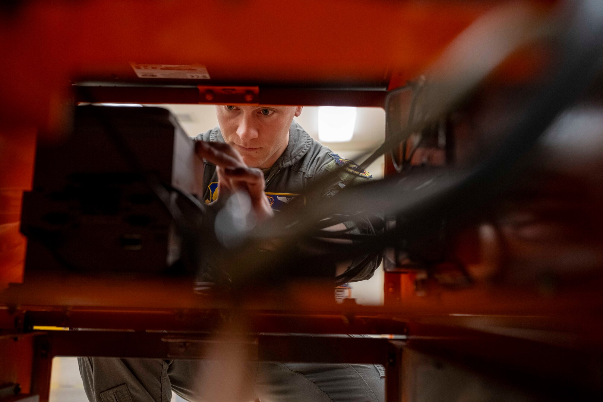 U.S. Space Force Capt. Gordon McCulloh, 746th Test Squadron Capabilities Development flight commander, operates on a GPS airborne jammer rack at Holloman Air Force Base, New Mexico, Dec. 3, 2024. For decades, the 746th TS has been one of the military's pioneers in testing guidance and navigation equipment since its inception in 1959. (U.S. Air Force photo by Senior Airman Isaiah Pedrazzini)