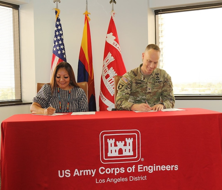 Tanya Lewis, chairwoman for the Yavapai-Apache Nation in Arizona, left, and Col. Andrew Baker, commander of the U.S. Army Corps of Engineers Los Angeles District, right, sign a project agreement Dec. 16 for design and construction assistance for the Yavapai-Apache Nation Wastewater Treatment Plant in Arizona. The project aims at providing a sustainable treatment method that will improve overall health, sanitation and security for the Nation, the environment and all communities that rely on the Verde River.