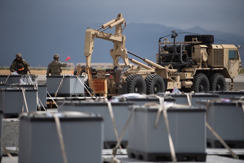 Airmen from the Kentucky Air National Guard’s 123rd Contingency Response Group prepare simulated cargo to be transported to a forward node at Amedee Army Airfield, Calif., Aug. 24, 2024, as a part of a U.S. Transportation Command exercise to revalidate the 123rd CRG’s capability to lead a Joint Task Force-Port Opening.