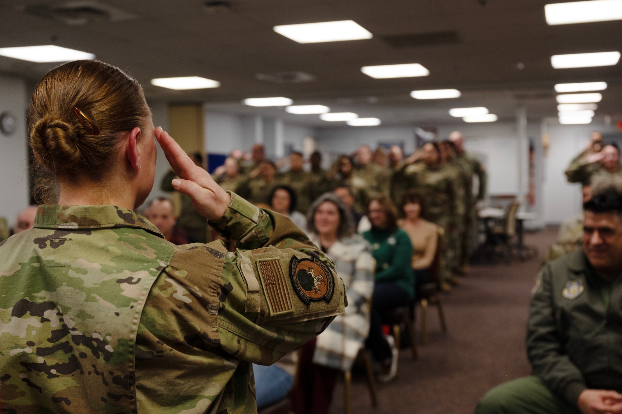 Lt. Col. Tiffany Changet, renders her first salute as the new 914th Force Support Squadron commander. During an assumption of command ceremony, the incoming commander receives a first salute from the unit's members.