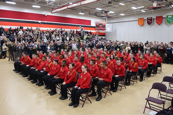 86 cadets of the Wisconsin National Guard Challenge Academy's class 53 are applauded by friends, family and attending dignitaries during their graduation ceremony December 21, 2024, at Necedah High School in Necedah, Wisconsin.