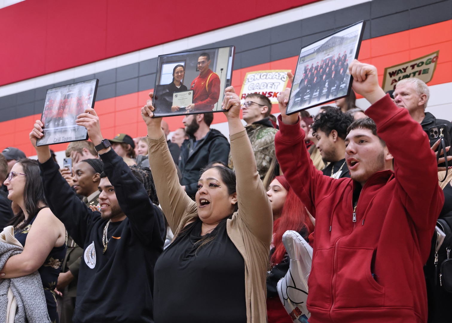 Family and friends applaud the cadets of Wisconsin National Guard Challenge Academy's class 53 during their graduation ceremony December 21, 2024, at Necedah High School in Necedah, Wisconsin.