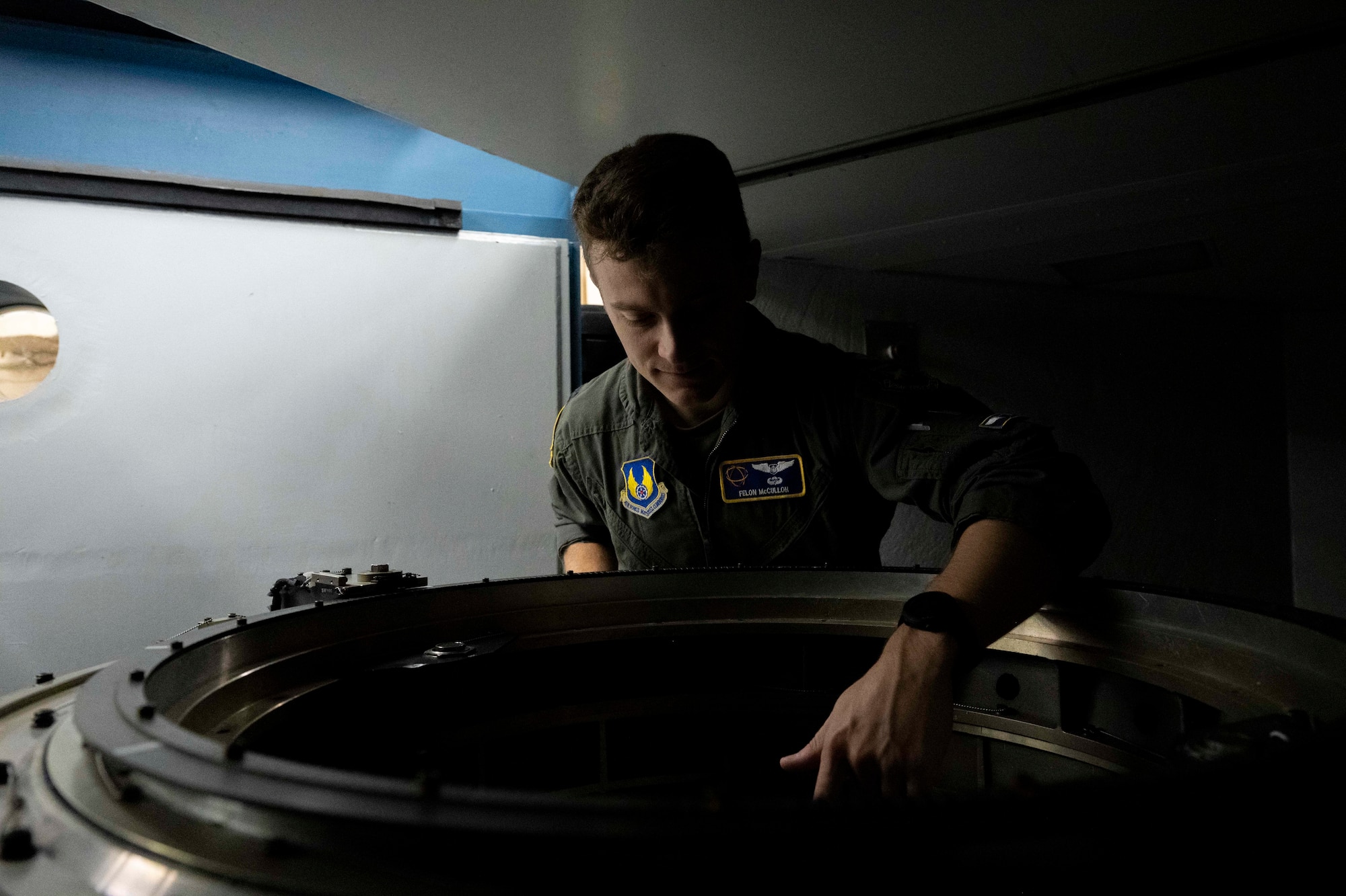 U.S. Space Force Capt. Gordon McCulloh, 746th Test Squadron Capabilities Development flight commander, inspects the interior of a centrifuge at Holloman Air Force Base, New Mexico, Dec. 3, 2024. For decades, the 746th TS has been one of the military's pioneers in testing guidance and navigation equipment since its inception in 1959. (U.S. Air Force photo by Senior Airman Isaiah Pedrazzini)