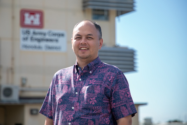 Dr. David Nguyen in front of the Honolulu District U.S. Army Corps of Engineers building December 16, 2024.