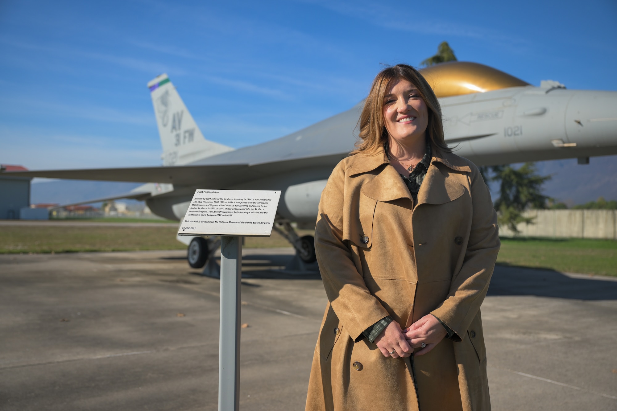 A woman standing in front of a static display