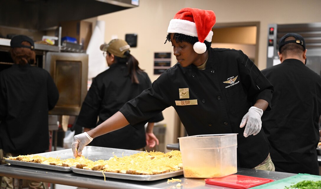 Food Services Airmen prepares food for meal