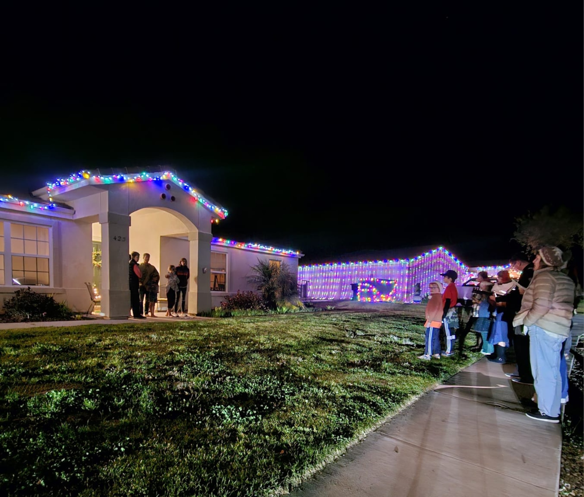 Children Christmas caroling.