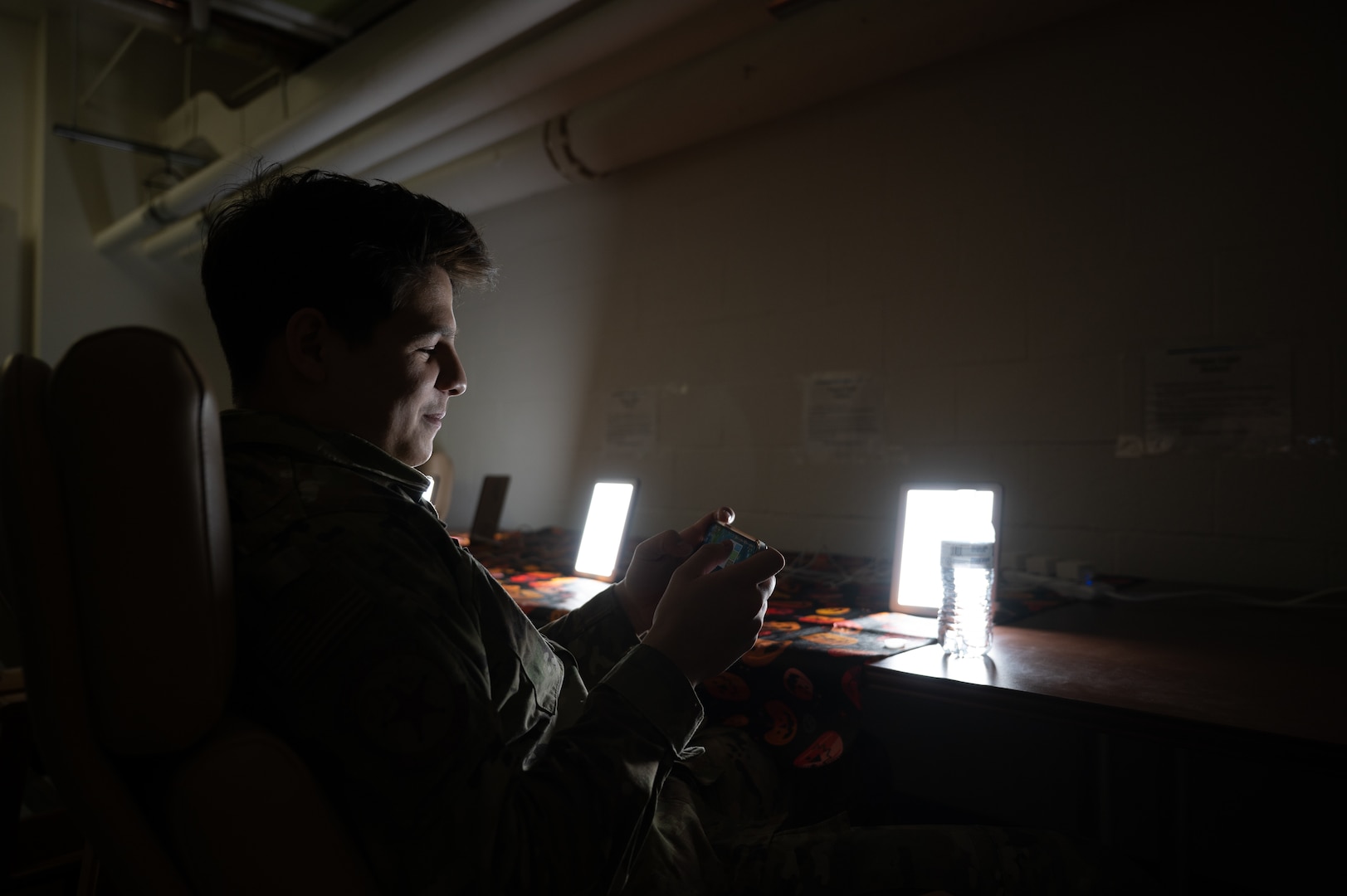 U.S. Air Force Airman and Security Forces member uses light therapy