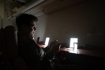 U.S. Air Force Airman and Security Forces member uses light therapy