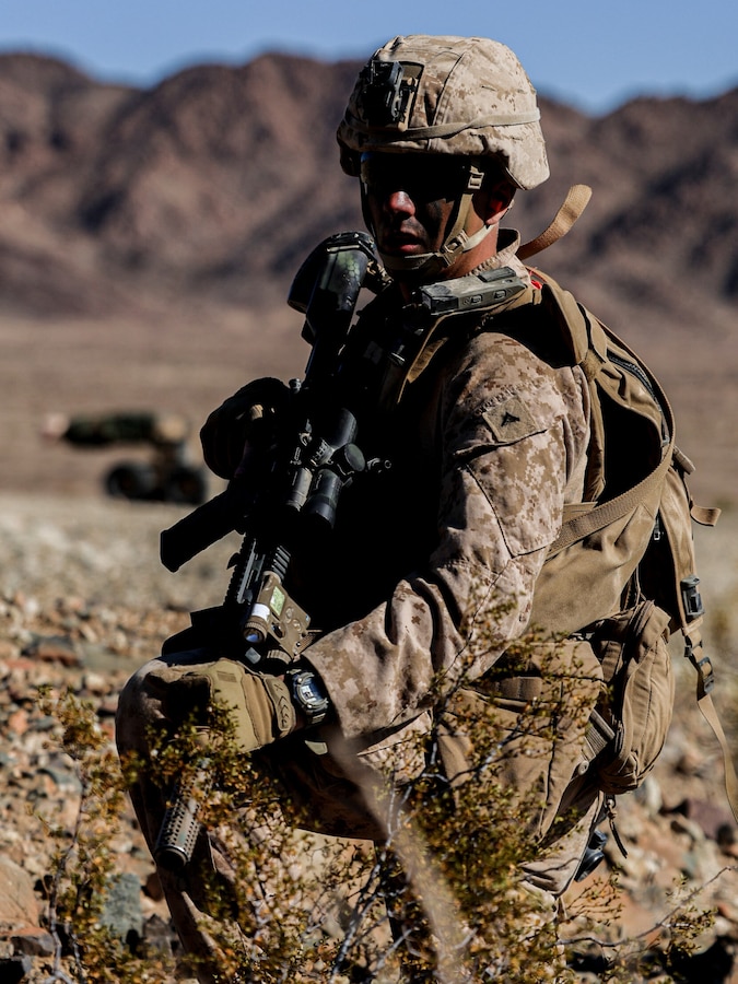 U.S. Marine Corps Lance Cpl. Soto Gilberto posts security during a platoon supported urban raid during an adversary force exercise at Marine Corps Air-Ground Combat Center, Twentynine Palms, California, Dec. 6, 2024. Gilberto is a rifleman from the Bronx, New York. The AFX is the primary readiness-building event prior to Echo Company, 2nd Battalion, 23rd Marine Regiment’s upcoming deployment to Okinawa, Japan, in support of the Marine Corps’ Unit Deployment Program. The exercise serves as an opportunity to receive training across all warfighting functions in a realistic and fully resourced environment. (U.S. Marine Corps photo by Lance Cpl. Orion Stpierre)