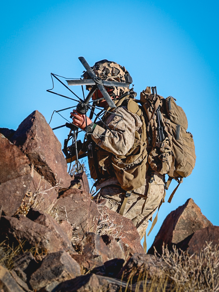 U.S. Marine Corps Cpl. Soren M. Marx sets up satellite equipment during an adversary force exercise at Marine Corps Air-Ground Combat Center, Twentynine Palms, California, Dec. 10, 2024. Marx is a transmission systems operator from Pasadena, California. The AFX is the primary readiness-building event prior to Golf Company, 2nd Battalion, 23rd Marine Regiment’s upcoming deployment to Okinawa, Japan, in support of the Marine Corps’ Unit Deployment Program. The exercise serves as an opportunity to receive training across all warfighting functions in a realistic and fully resourced environment. (U.S. Marine Corps photo by Lance Cpl. Orion Stpierre)