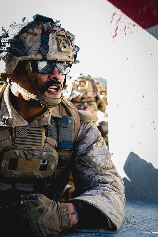 U.S. Marine Corps Sgt. Joshiwa Juni directs his squad’s movements while clearing buildings during an adversary force exercise at Marine Corps Air-Ground Combat Center, Twentynine Palms, California, Dec. 10, 2024. Juni is a squad leader from Palmdale, California. The AFX is the primary readiness-building event prior to Golf Company, 2nd Battalion, 23rd Marine Regiment’s upcoming deployment to Okinawa, Japan, in support of the Marine Corps’ Unit Deployment Program. The exercise serves as an opportunity to receive training across all warfighting functions in a realistic and fully resourced environment. (U.S. Marine Corps photo by Lance Cpl. Orion Stpierre)