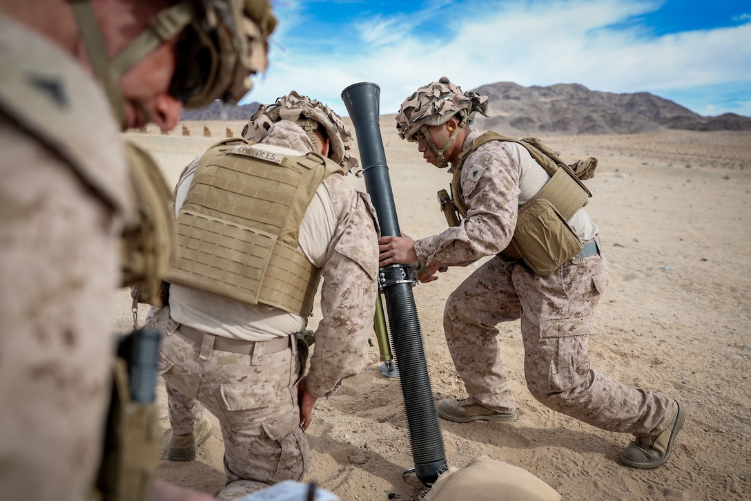 U.S. Marines with 2nd Battalion, 23rd Marine Regiment, fire mortars during training for upcoming deployment