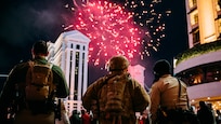 A Soldier with the 72nd Military Police Company works with local law enforcement during the fireworks show, signifying the new year, on the Las Vegas Strip on Jan. 1, 2022 in Las Vegas, Nevada.