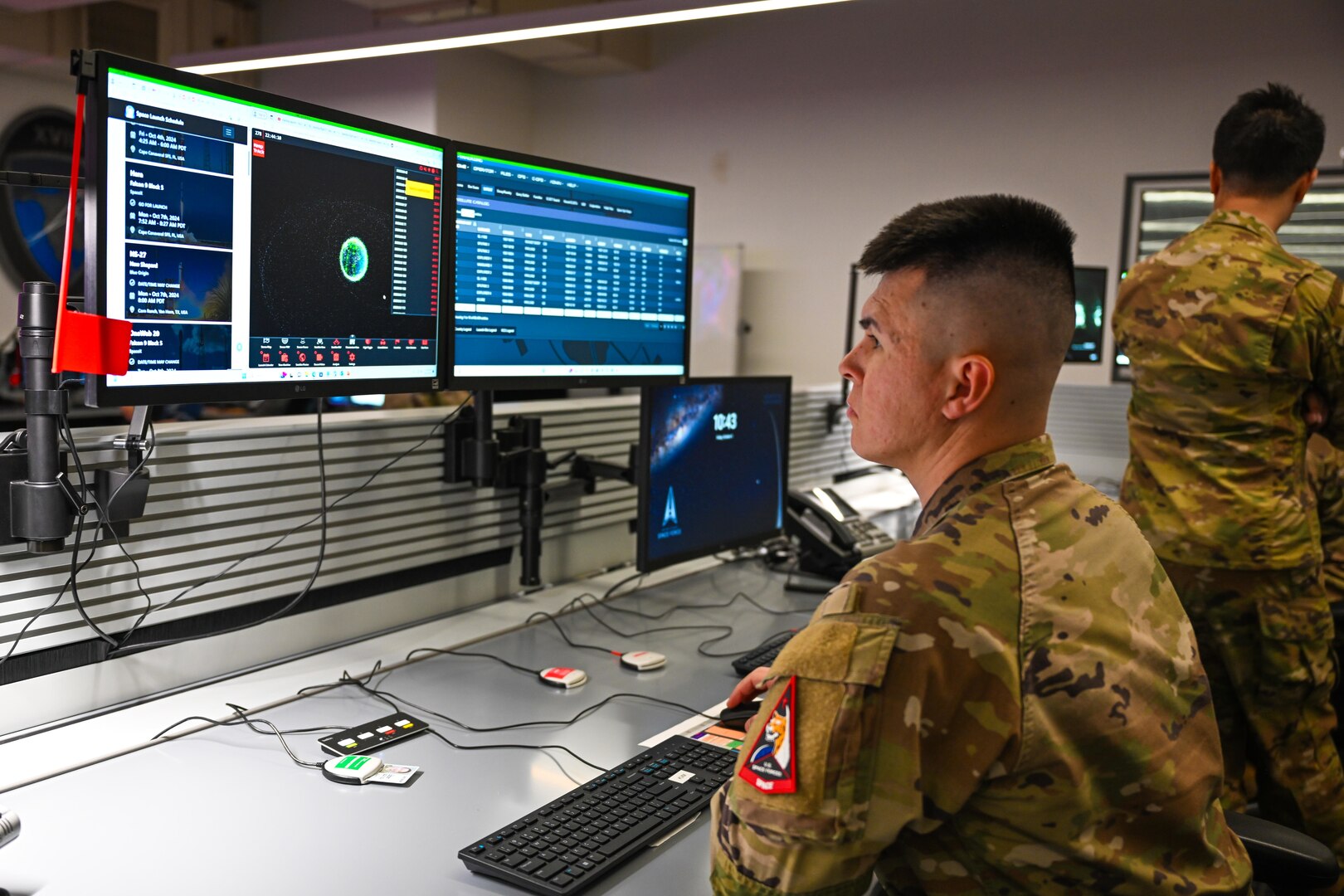 military member sitting at computer screen