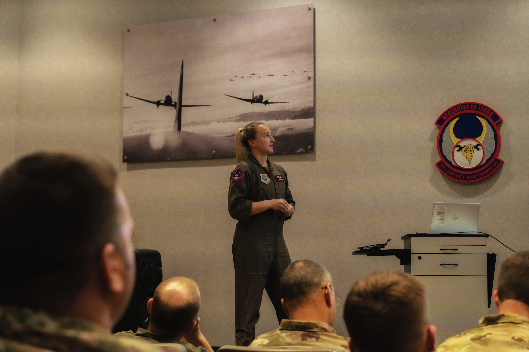 U.S. Air Force Capt. Allyson Swift, 317th Airlift Wing Chief of Tactics, briefs during Hazard Hour at Dyess Air Force Base, Texas, Dec. 6, 2024. Joint Leadership Development is structured to delve into classified aspects of Joint Force mission sets and prepare 317th Airmen for rapid integration into a Joint contingency. (U.S. Air Force photo by Senior Airman Alondra Cristobal Hernandez)