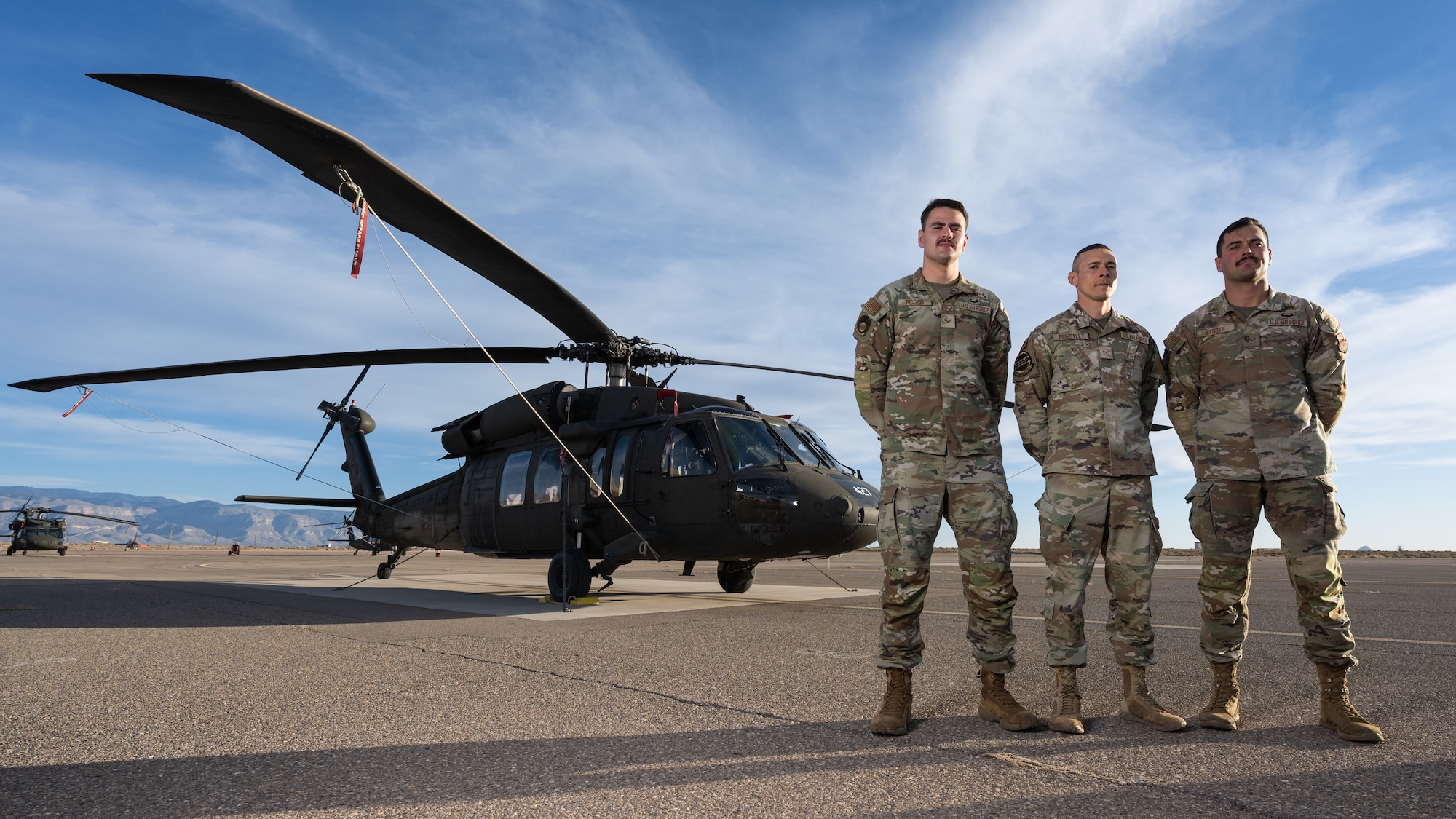 U.S. Air Force Senior Airman Joshua Ricchio, 49th Equipment Maintenance Squadron inspection journeyman, left, Airman 1st Class Ian Priestly, 49th Communication Squadron network technician, center, and U.S. Air Force Senior Airman Andrew Byorth, 49th EMS inspection journeyman, right, pose for a photo at Holloman Air Force Base, New Mexico, Dec 17. 2024. Each Airman achieved a milestone of grit and excellence, earning the coveted Air Assault badge after conquering the U.S. Army Air Assault School at Fort Campbell, Kentucky. (U.S. Air Force photo by Senior Airman Antonio Salfran)