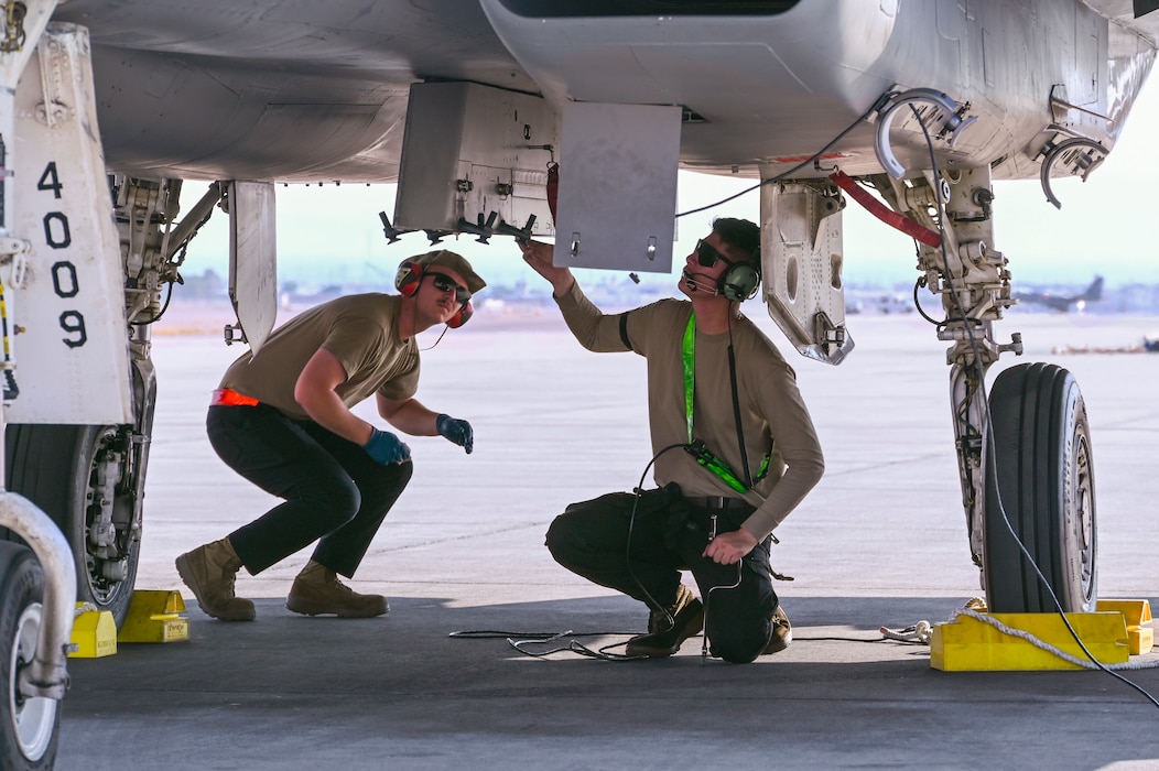 U.S. Air Force Staff Sgt. Jerry Sumpter and Senior Airman Bryan Pelayo-Rangel, 144th Fighter Wing maintainers, prepare an F-15 Eagle for launch, Sept. 10, 2024, at Nellis Air Force Base, Nevada.