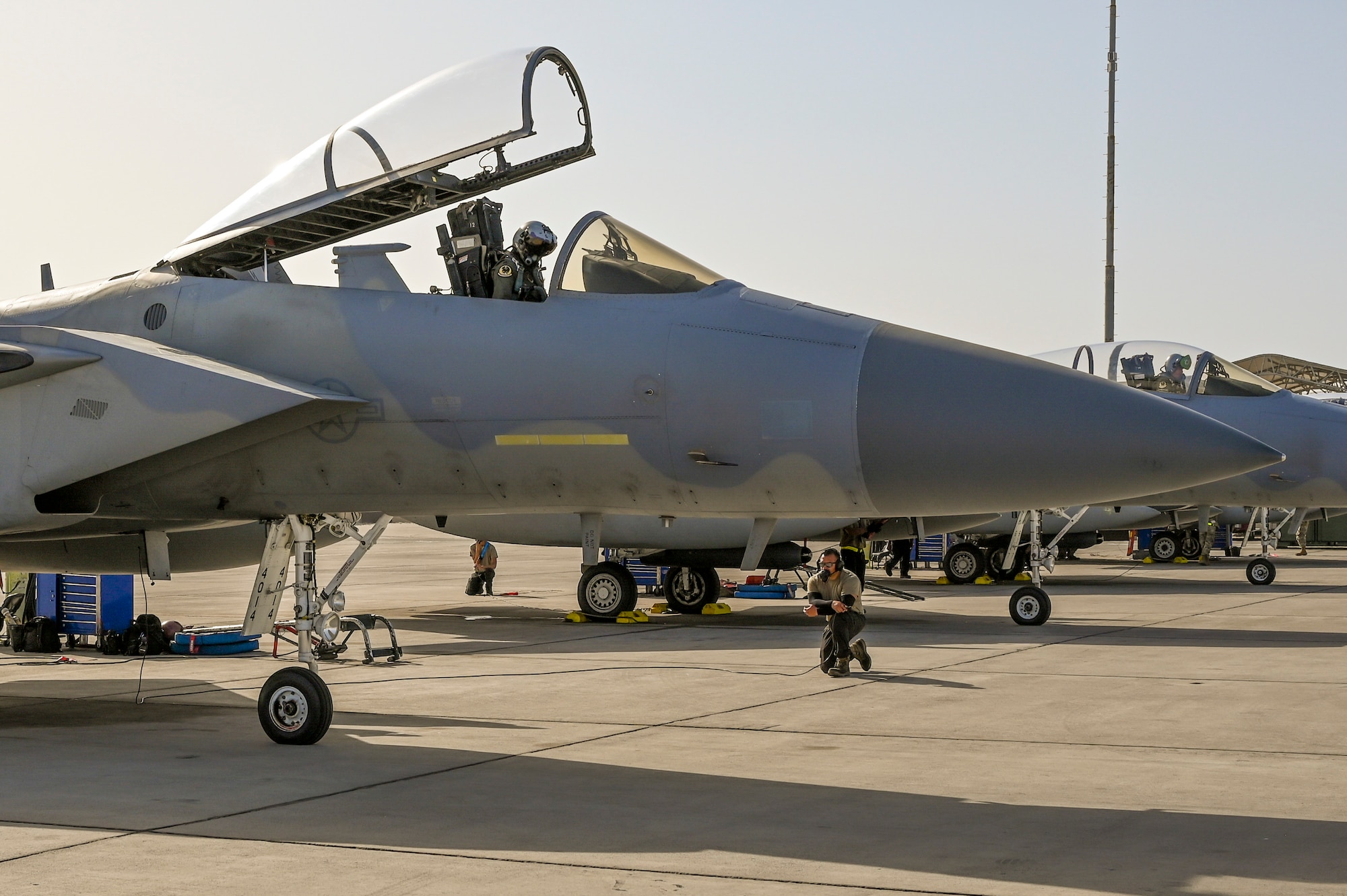 A 144th Fighter Wing crew chief waits to marshal out an F-15C Eagle, Sept 12, 2024, while stationed at Nellis Air Force Base, Nevada, to support the F-15 weapons instructor course.